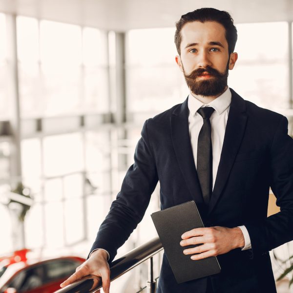 handsome-and-elegant-man-in-a-car-salon-2023-11-27-04-56-15-utc